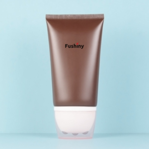 Brown squeeze roller ball tube with 3 metal balls printed "fushiny"