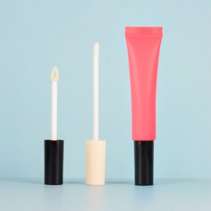 A lip gloss squeeze tube and two applicators