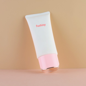 oval sunscreen plastic tube with screw cap labeled "fushiny"