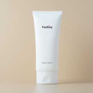 Oval matte white squeeze tube with flip cap printed "fushiny" and "100ml/3.38fl.oz"