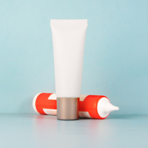Plastic squeeze tube with nozzle